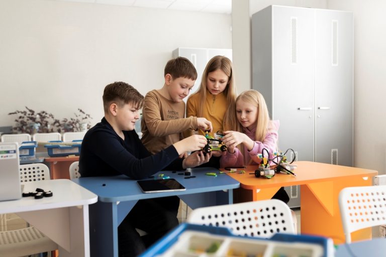 four-kids-building-drone-using-electronic-parts
