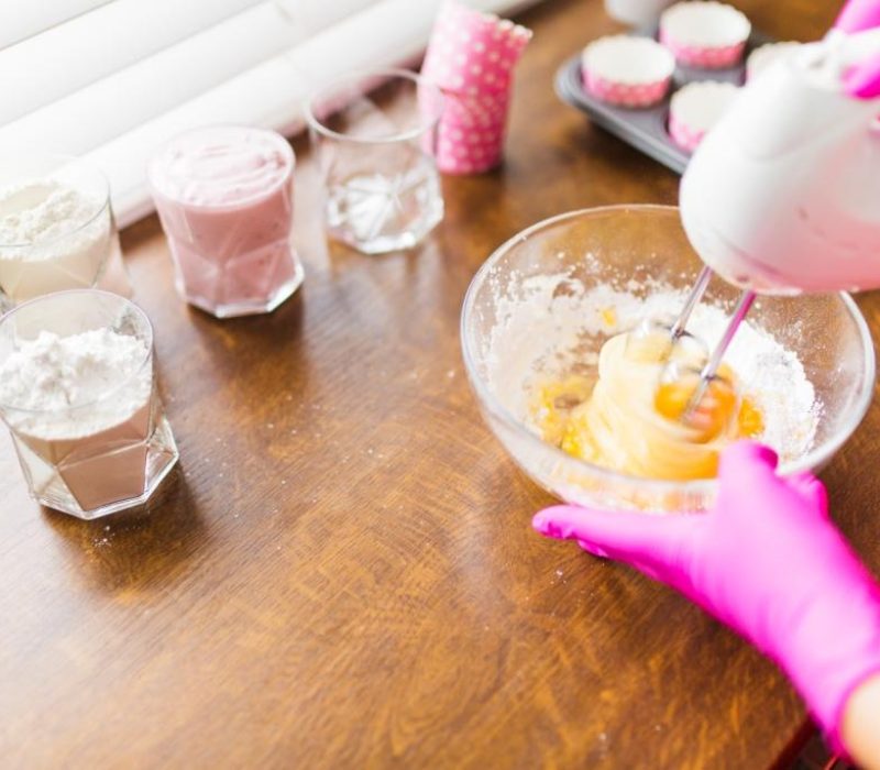 crop-hands-mixing-batter-cupcakes